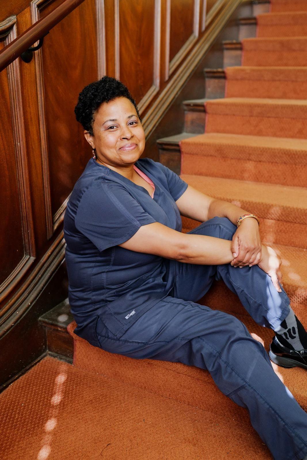 Evangela Nichols-Gordon in navy scrubs